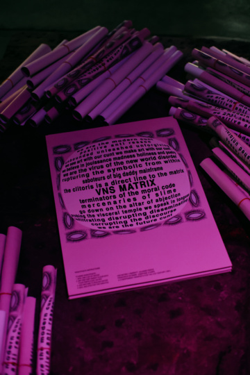 Installation shot, giveaway posters, Cyberfeminist Manifesto for the 21st Century, VNS Matrix, Biennale of Sydney, White Bay Power Station 2024